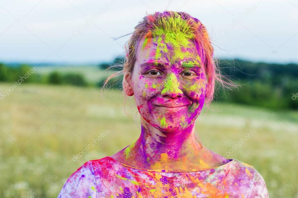 woman with colorful paint on face