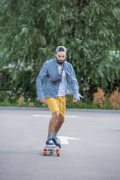 man riding longboard