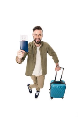 man with suitcase, passport and tickets clipart