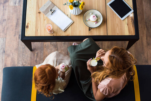mother and daughter in cafe