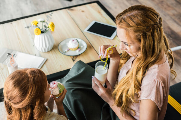 mother and daughter in cafe