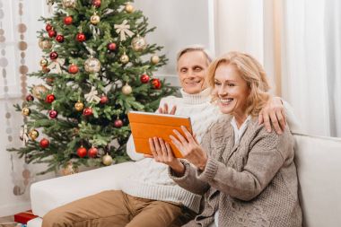 couple making video call on christmas clipart