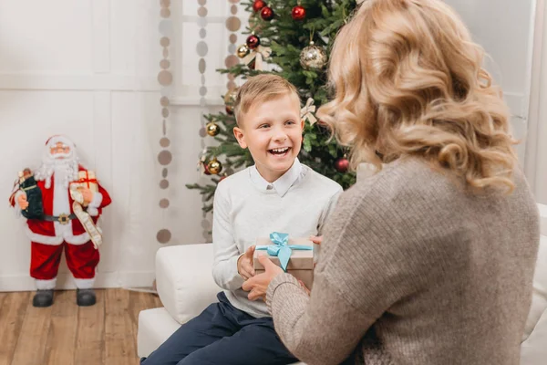 Woman with son on christmas — Free Stock Photo