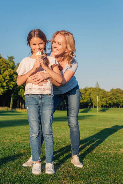 grandmother and kid with ice cream
