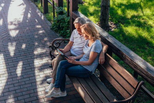 senior couple with tablet