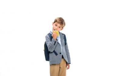 hungry schoolboy eating apple