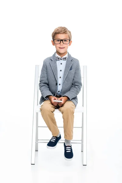 Happy schoolboy with smartphone — Stock Photo, Image