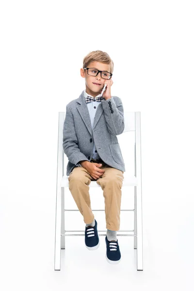 Schoolboy talking by phone — Stock Photo, Image