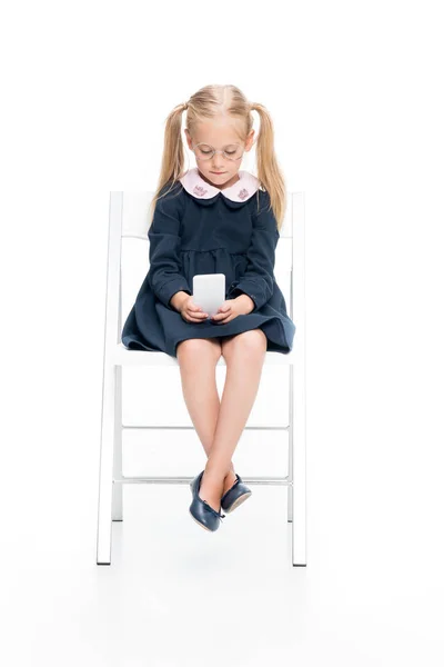 Schoolgirl using smartphone — Stock Photo, Image