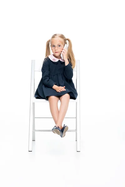 Schoolgirl on talking by phone — Stock Photo, Image