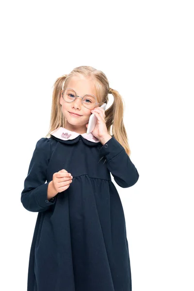 Schoolgirl talking by phone — Stock Photo, Image