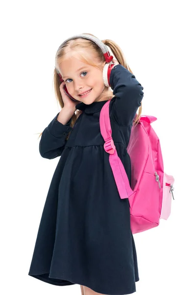 Hermosa colegiala con auriculares — Foto de Stock