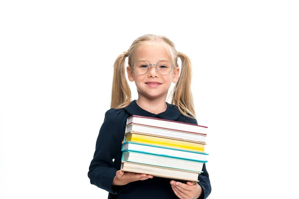 Школьница со стопкой книг — стоковое фото