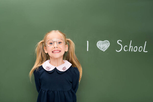 happy schoolgirl in eyeglasses