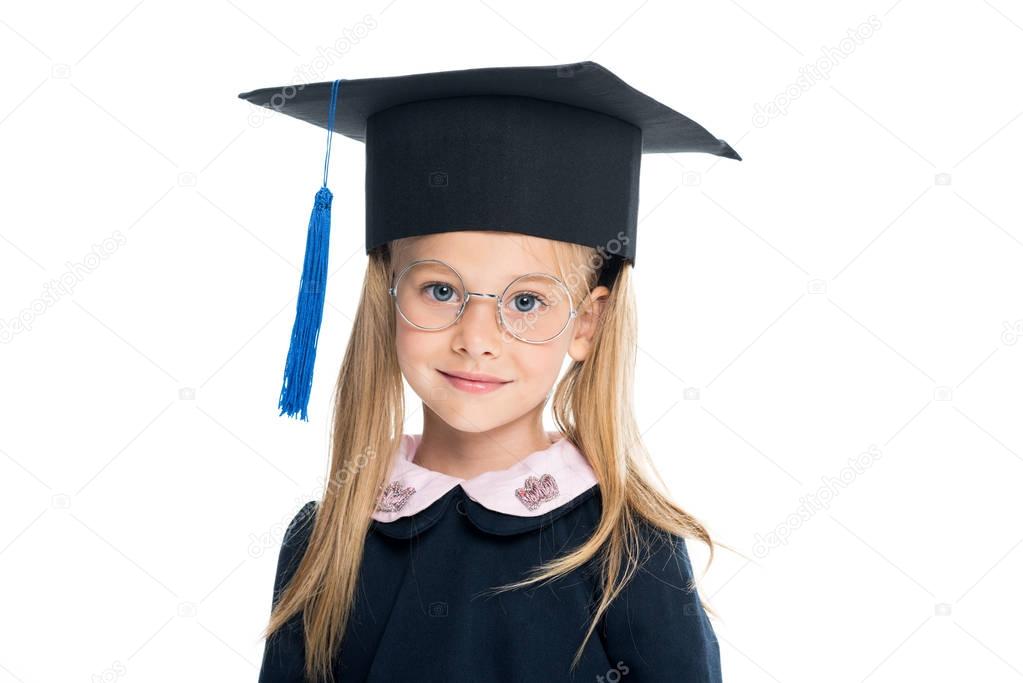 little schoolgirl in graduation hat