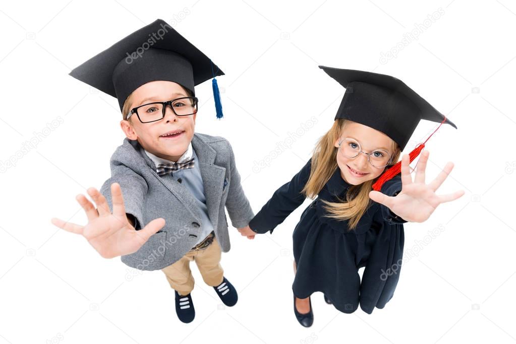 pupils in graduation hats