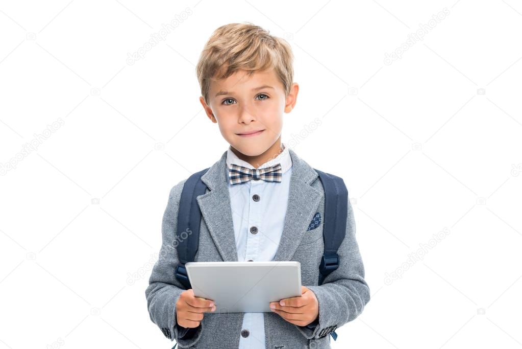 smiling schoolboy with digital tablet