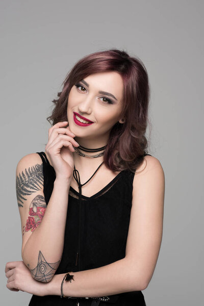 Young woman with hand on chin