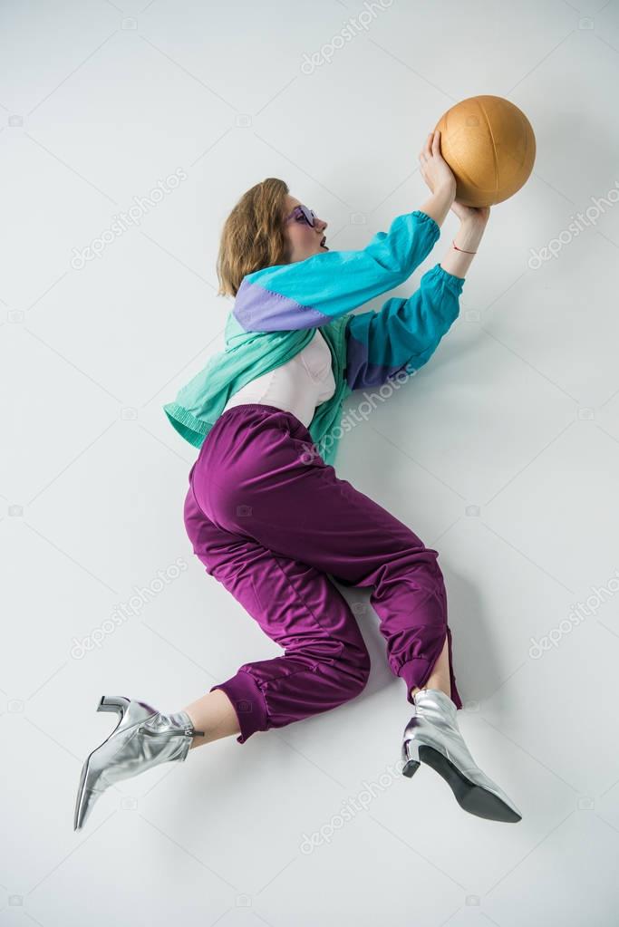 stylish woman holding ball