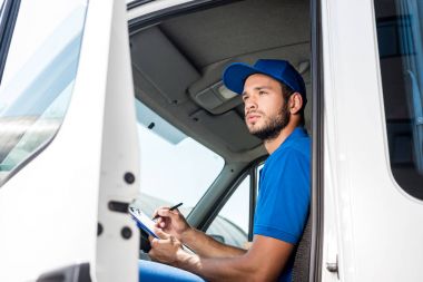 delivery man filling in documents clipart