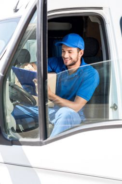 delivery man filling in documents clipart