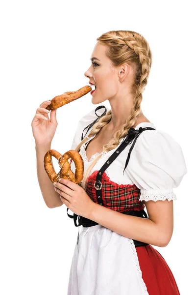 Alemão menina comer pretzels — Fotografia de Stock Grátis