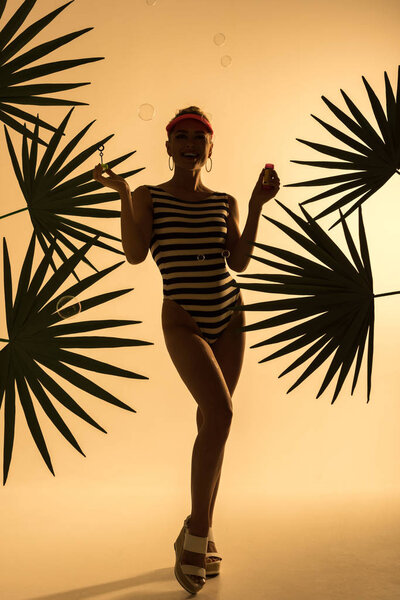 stylish young woman with soap bubbles