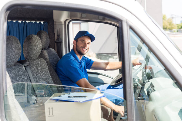 delivery man sitting in car