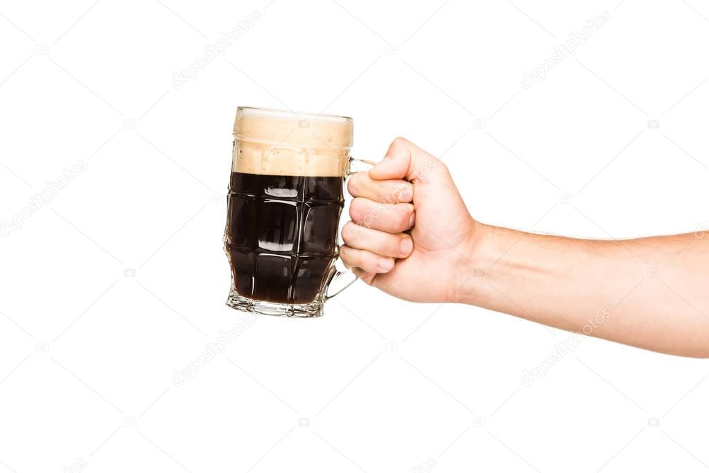 person with glass of dark beer