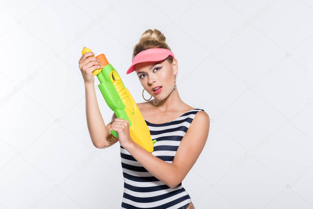 fashionable woman with water gun