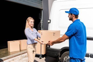 courier giving package to woman clipart