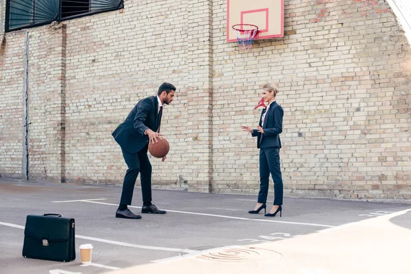 Business colleagues playing basketball — Stock Photo, Image