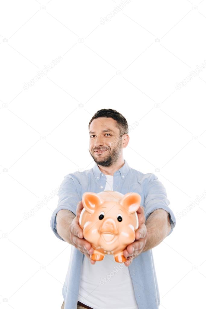 man holding piggy bank