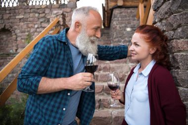 mature couple drinking wine clipart