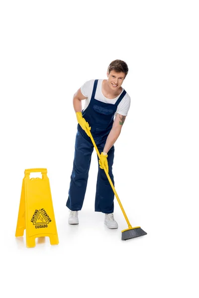 Cleaner tidying floor with broom — Stock Photo, Image