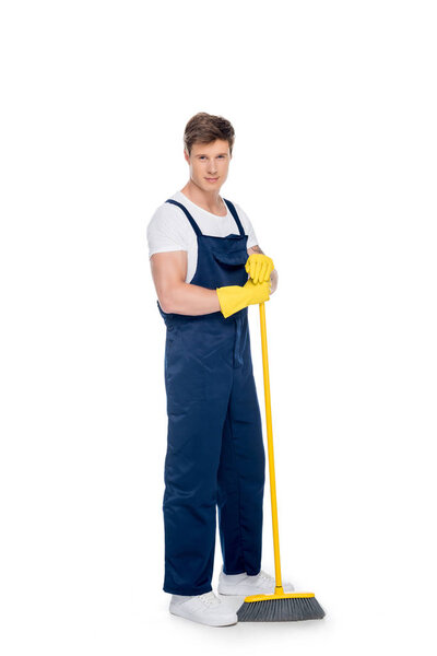 cleaner in rubber gloves with broom