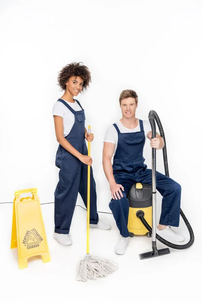 Multiethnic cleaners with cleaning supplies — Stock Photo, Image