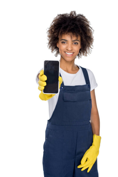 african american cleaner with smartphone