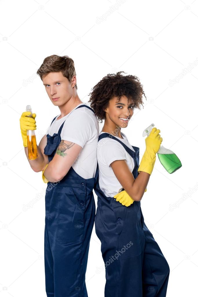multiethnic cleaners with cleaning supplies