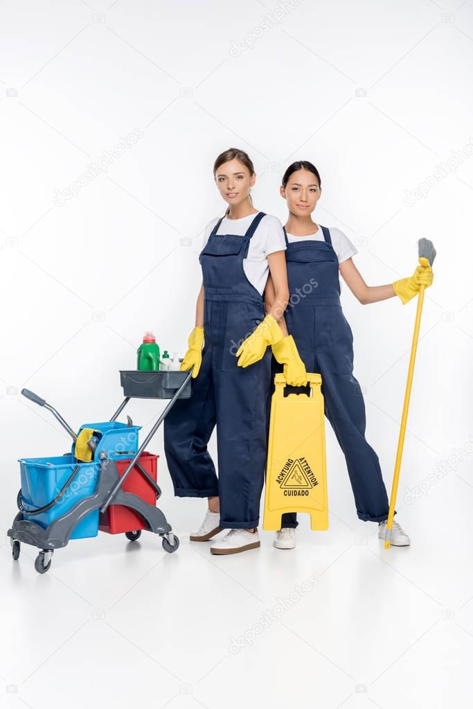 multicultural cleaners with cleaning equipment