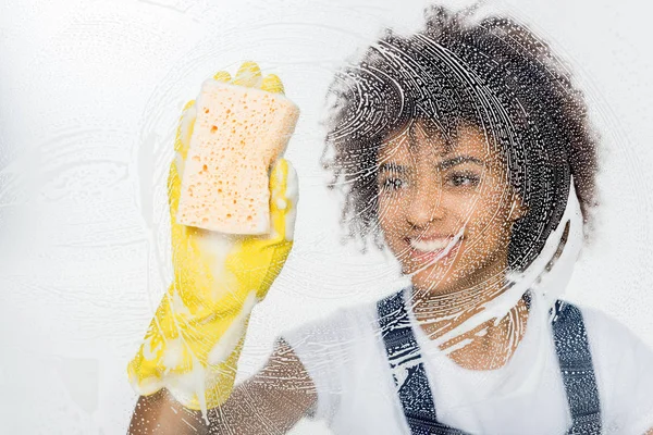 African american cleaner cleaning window — Stock Photo, Image