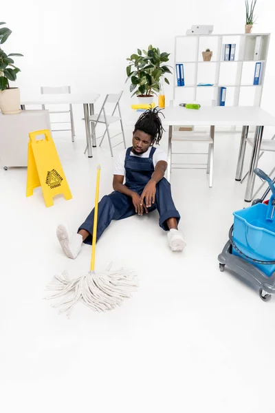 Tired african american cleaner — Stock Photo, Image
