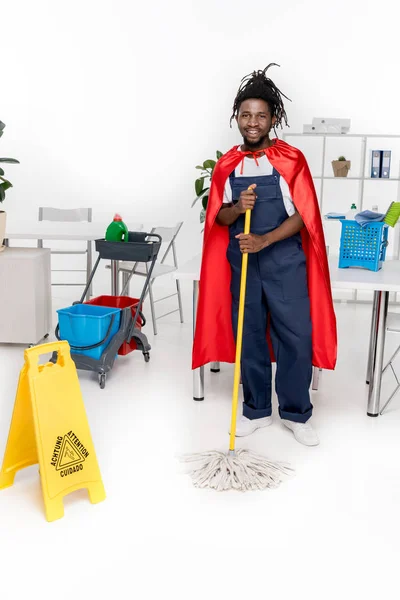 African american cleaner in superhero costume — Stock Photo, Image