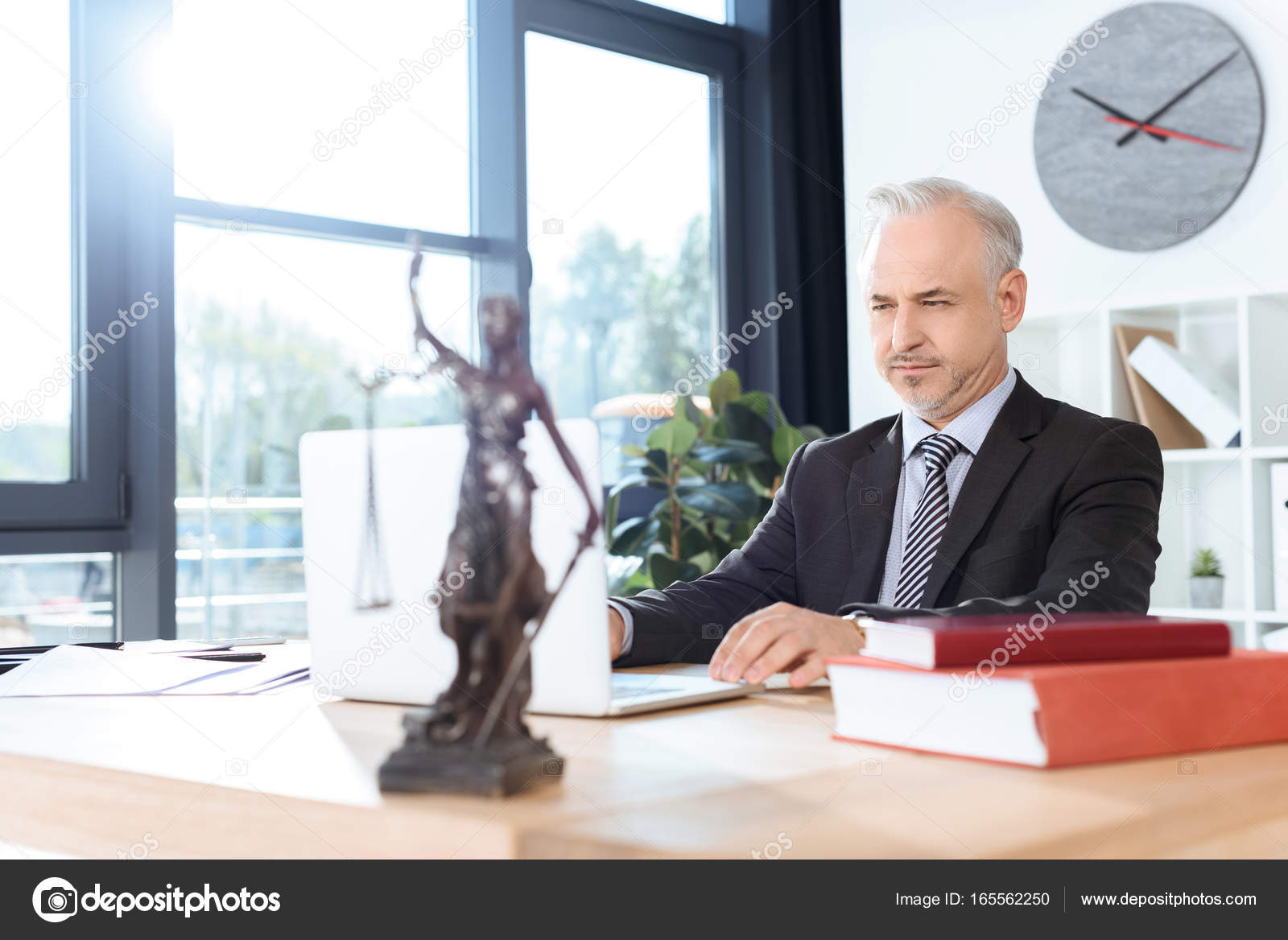 Lawyer working with laptop — Stock Photo © IgorVetushko #165562250