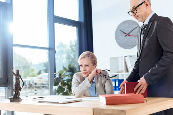 Mature overworked colleagues — Stock Photo, Image