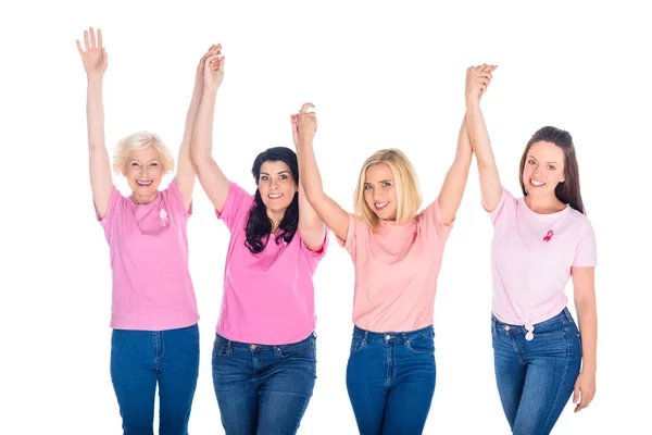 Mulheres em camisetas rosa de mãos dadas — Fotografia de Stock