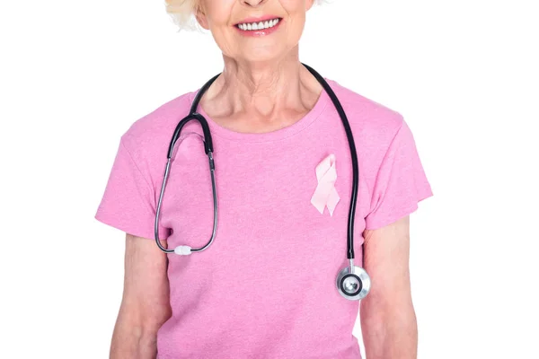 Senior woman with pink ribbon and stethoscope — Stock Photo, Image