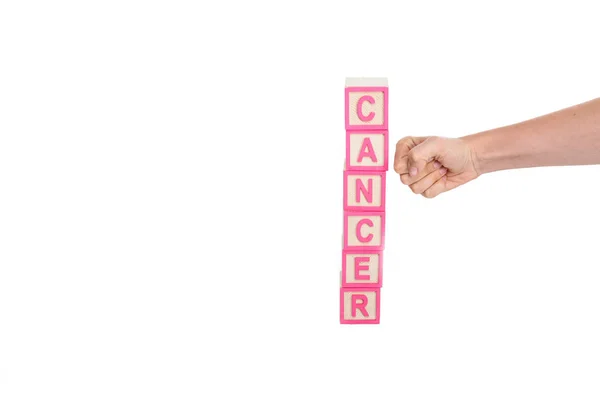 Fist breaking cubes with word cancer — Stock Photo, Image