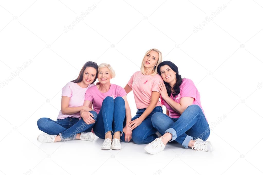 women in pink t-shirts with ribbons