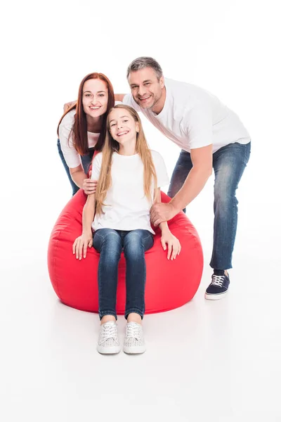 Family sitting in bean bag chair — Free Stock Photo